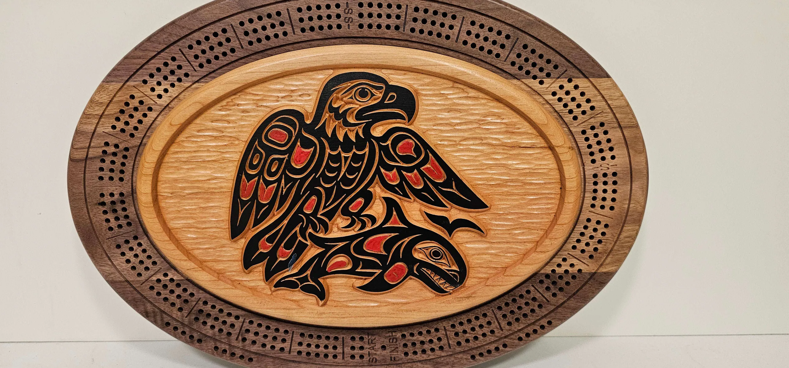 Handcrafted eagle with salmon cribbage board